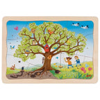 Children's puzzle with a tree and children playing, featuring the brand 'Goki'.