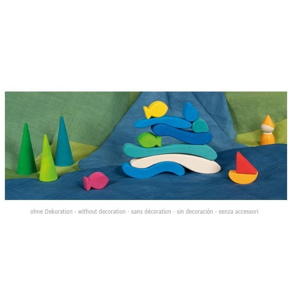 Colorful wooden toys on a blue surface with green background