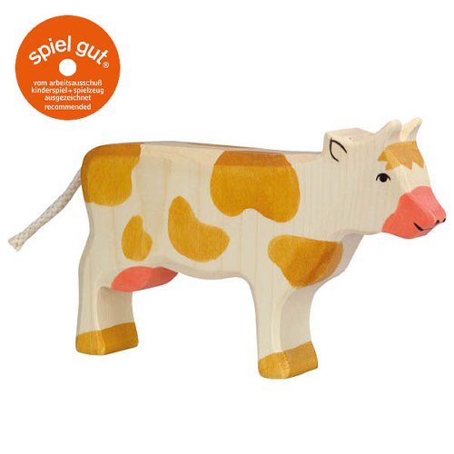 Wooden cow toy with a 'spiel gut' label on a white background