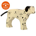 Wooden dog toy with black spots and a 'spiel gut' label on a white background