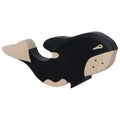 Wooden toy orca whale with black and beige colors on a white background