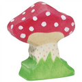 Wooden mushroom figurine with a red cap and white spots on a green base