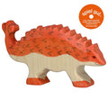 Wooden dinosaur toy with orange and beige colors on a white background, featuring the 'spiel gut' logo.