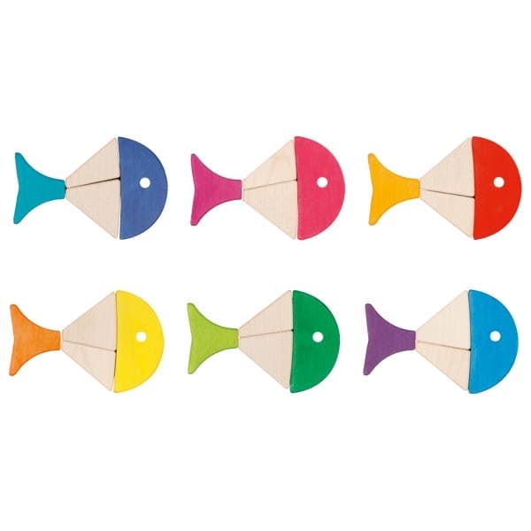 Set of colorful wooden fish toys on a white background