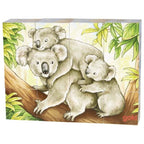 Three koalas on a branch with leaves in the background, featuring the brand 'Goki'.