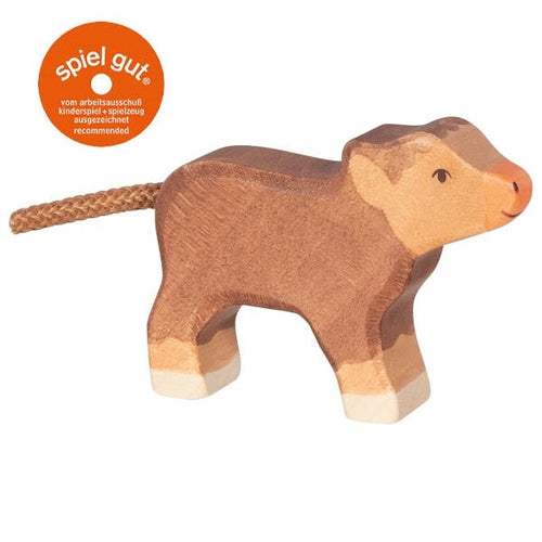 Wooden cattle calf toy with 'spiel gut' logo on a white background