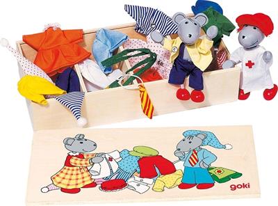 Children's toy set with dress-up clothes and accessories, including a box of clothes and a pegboard with dolls.