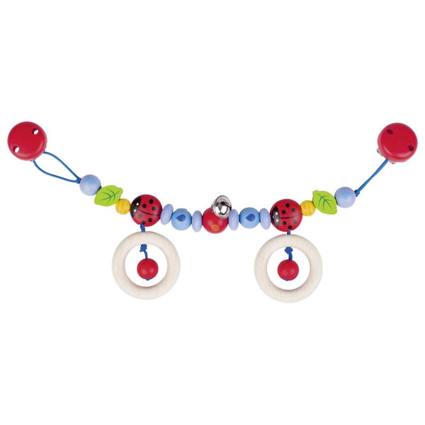 Colorful baby pram toy with beads and rings on a white background