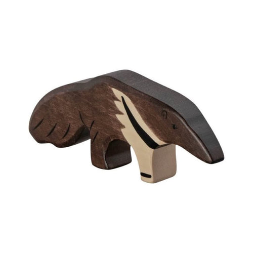 Wooden anteater figurine on a beige background