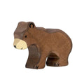 Wooden bear figurine on a white background