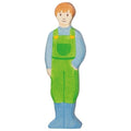 Wooden toy figure of a man wearing green overalls on a white background