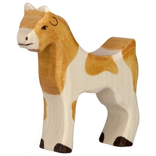 Wooden goat figurine with a brown and white pattern on a white background