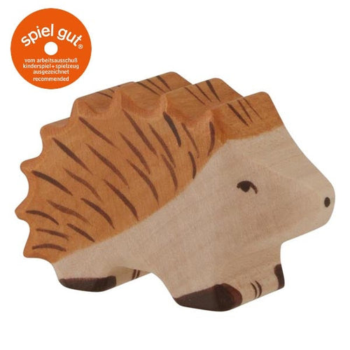 Wooden hedgehog toy with 'spiel gut' logo on a white background