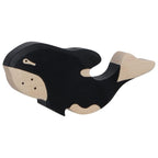 Wooden toy whale on a white background