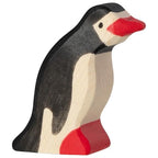 Wooden penguin toy on a white background