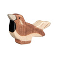 Wooden Sparrow Toy by Holztiger. the bird is Brown on a beige base.