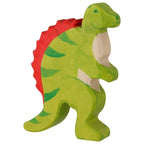 Green dinosaur toy with red spikes on a white background